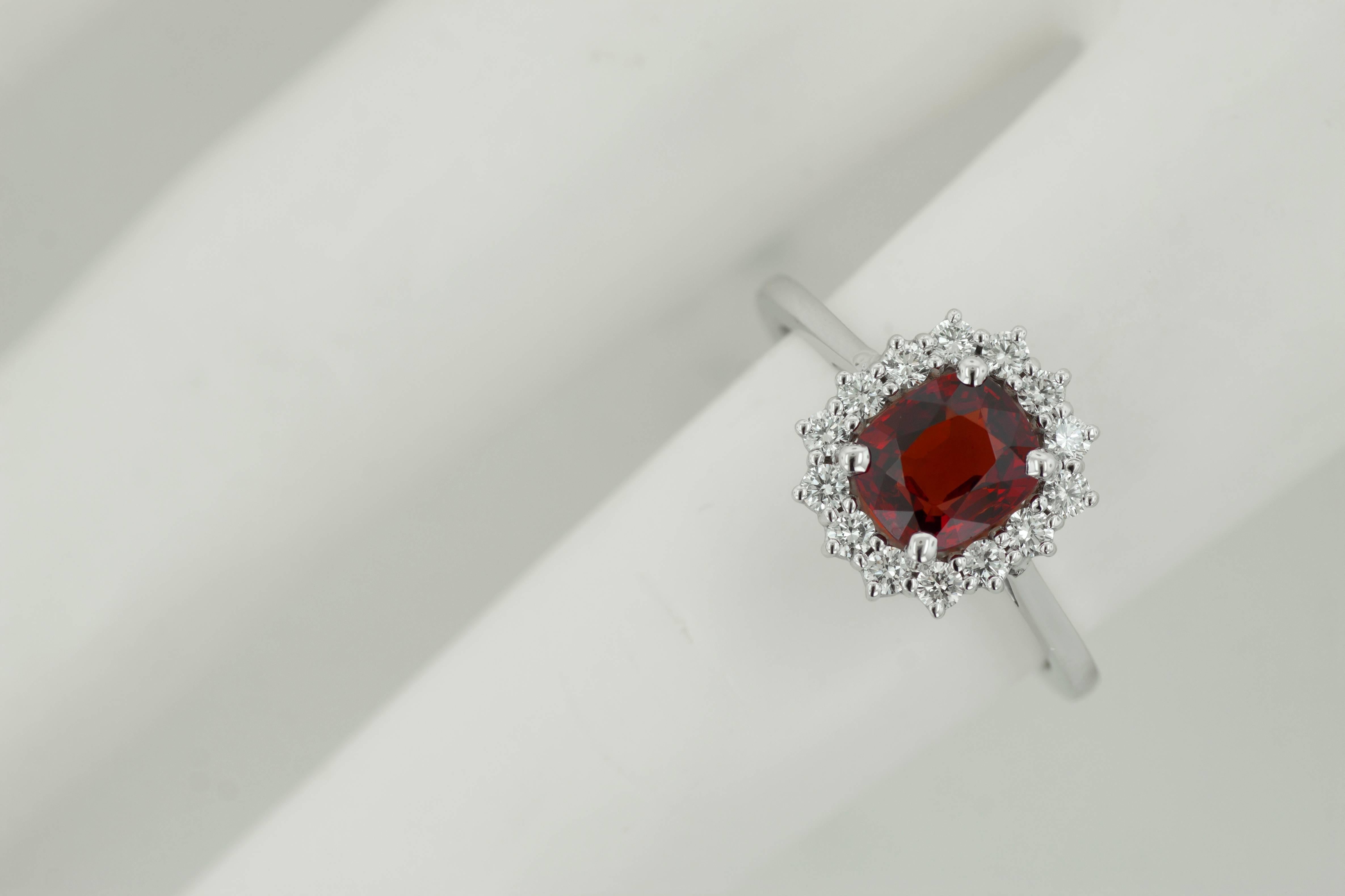 Beautiful Belle Époque inspired spinel and diamond engagement ring by Tears Undressed. This brand new 14 karat white gold hand-made ring is set with an elegant 1.78ct spinel center stone encircled by a beautiful halo of 14 white round diamonds. The