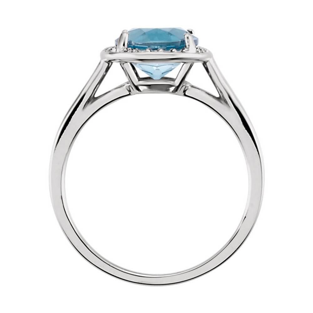 Exclusive brand new cocktail ring with a genuine London Blue topaz, encircled by a sparkling halo of white diamonds. The ring is a size 7 and is complimentary resized by us for a perfect fit.

✓ Jewelry report included 
✓ Tears Undressed