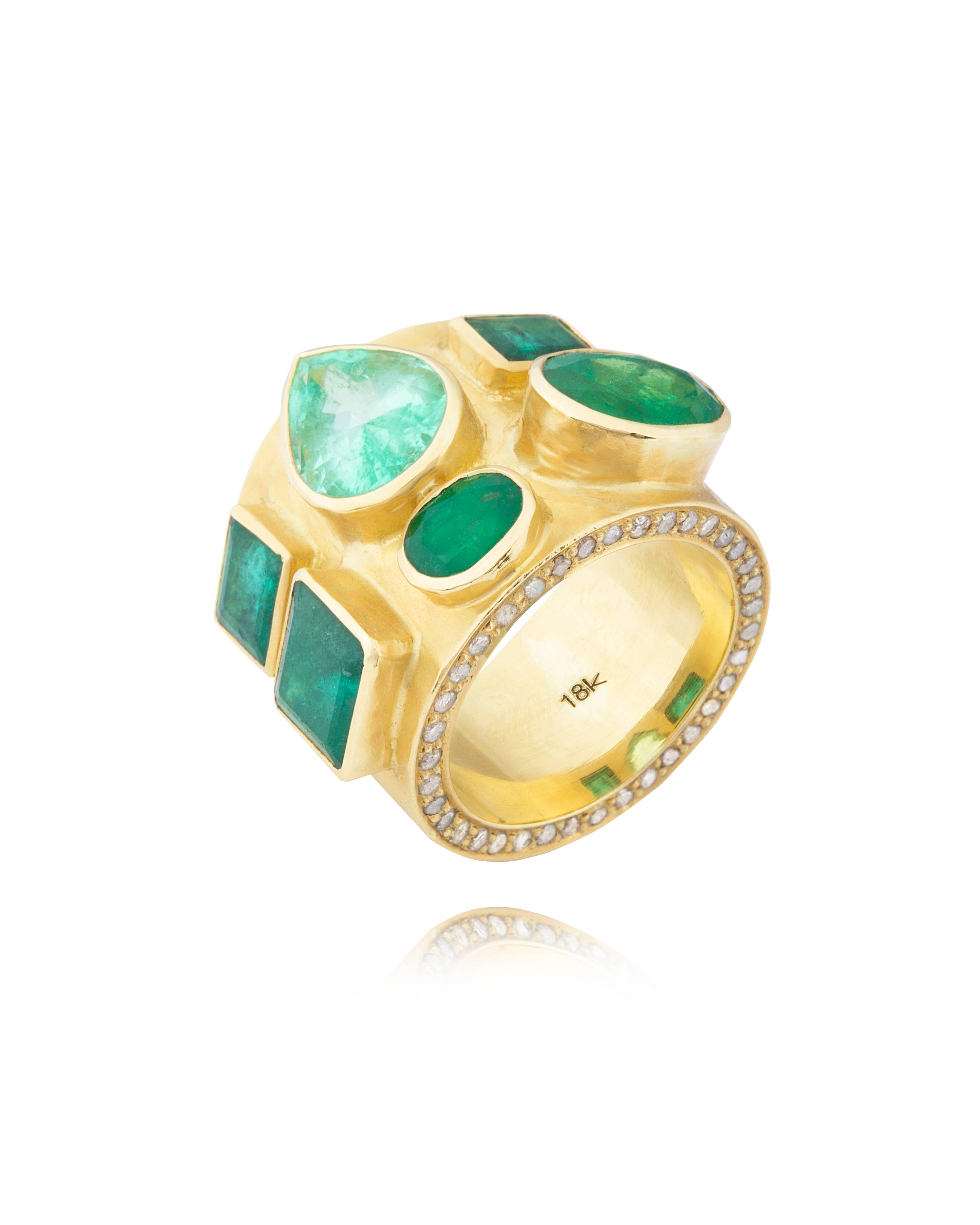 Mix of 6 Colombian and Zambian Emeralds on 18 karat hand beaten gold with circling diamonds on the outer edges of the ring.

This is a bespoke ring made on order. The Emerald Labyrinth Ring normally takes around 8 weeks to ship from date of order.