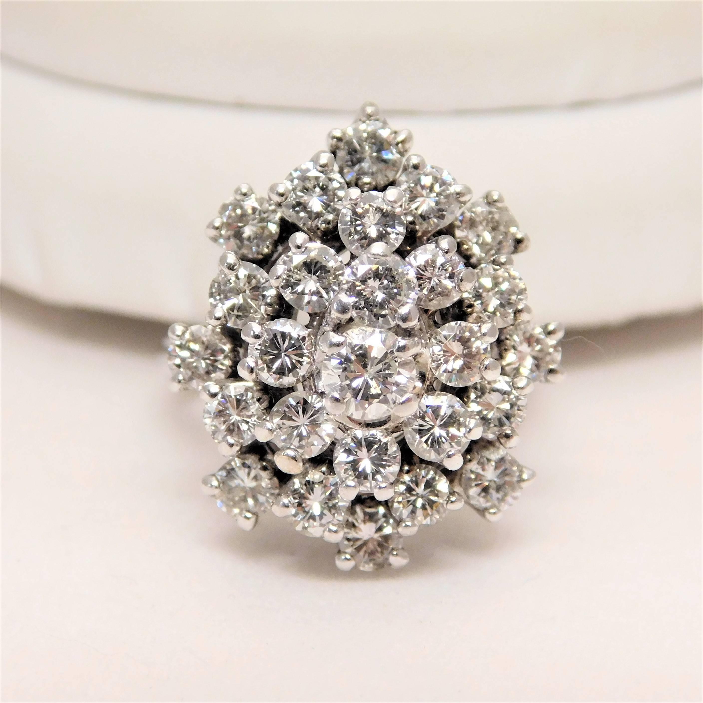 Elegant Vintage 14k White Gold Diamond Cluster Ring

From a gorgeous New Orleans estate.  Circa 1970’s.  This impressive snowflake cluster-style ring is made of solid 14kt white gold.  Restored to its original immaculate condition, it is ornately