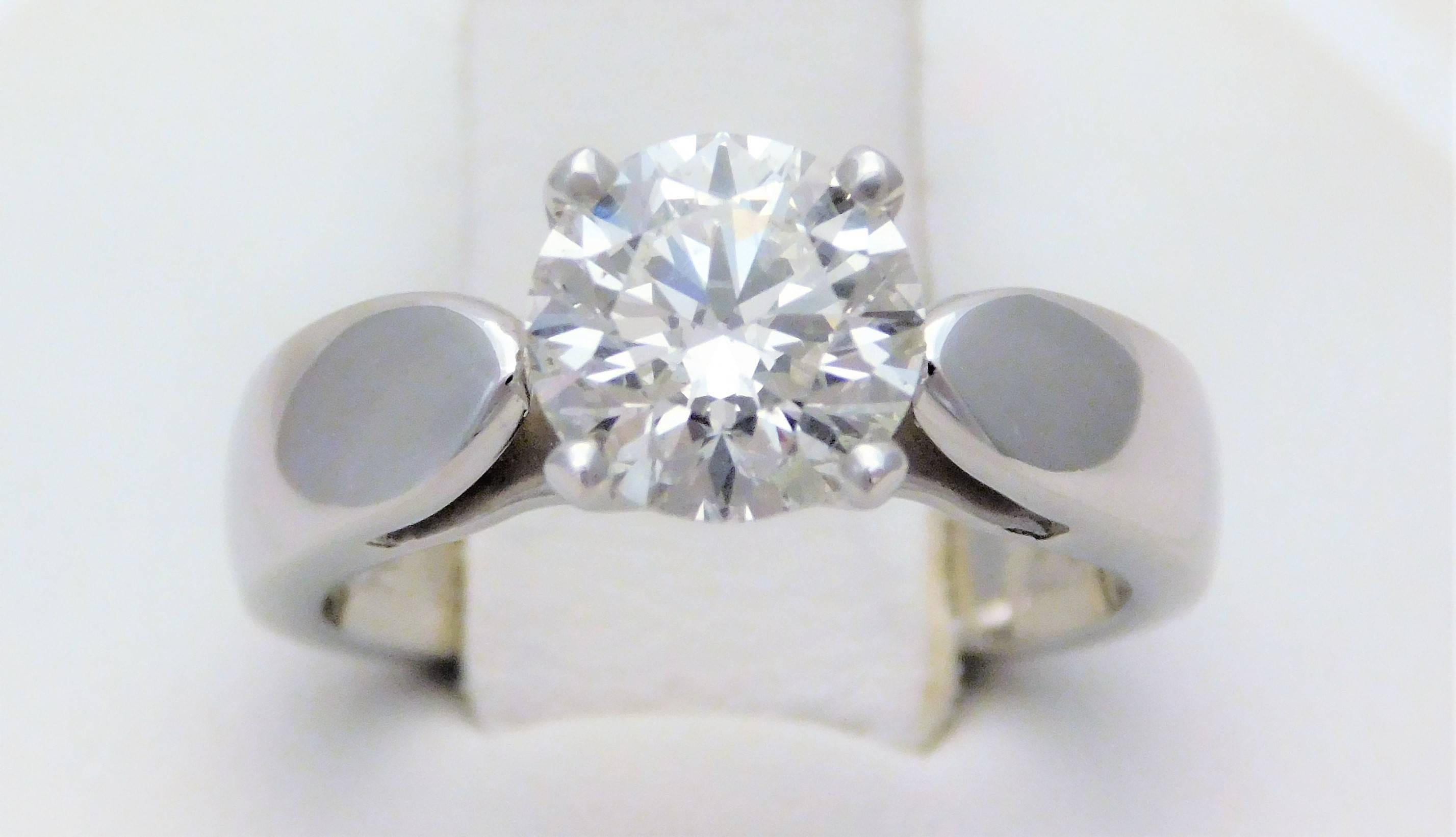 From a distinguished Southern estate.  Circa 2007.  This breathtaking solitaire engagement ring has been crafted in solid 14k White gold with a polished finish.  It has been masterfully jeweled with a GIA certified 1.28ct round brilliant-cut diamond
