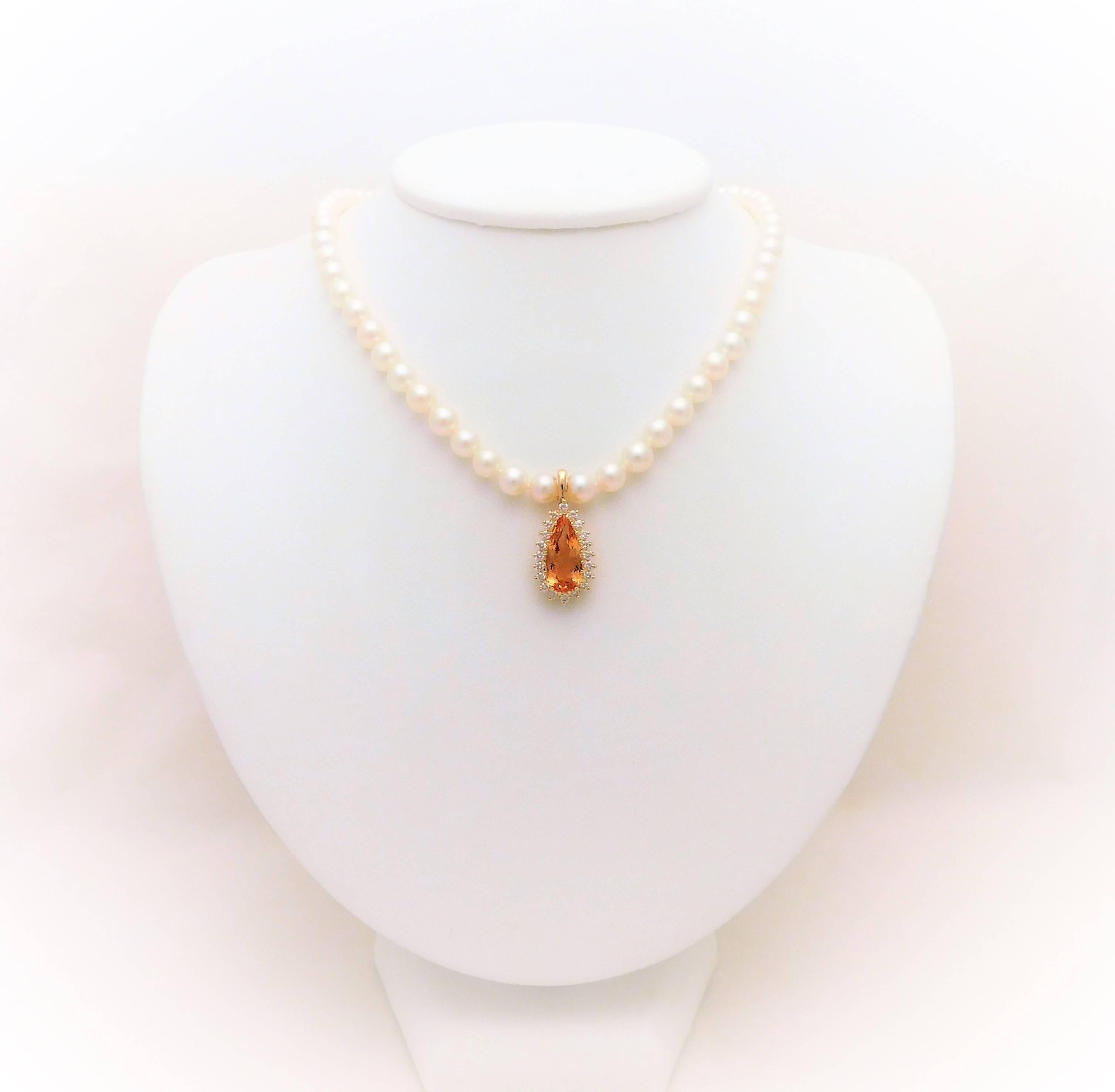 From a Southern aristocratic estate.  Circa 1970.  This gorgeous pendant is made of solid 14k yellow gold. It has been masterfully jeweled with an exquisite 7 ct pear brilliant-cut honey Topaz. Surrounding this fine gemstone are 20 immaculate G