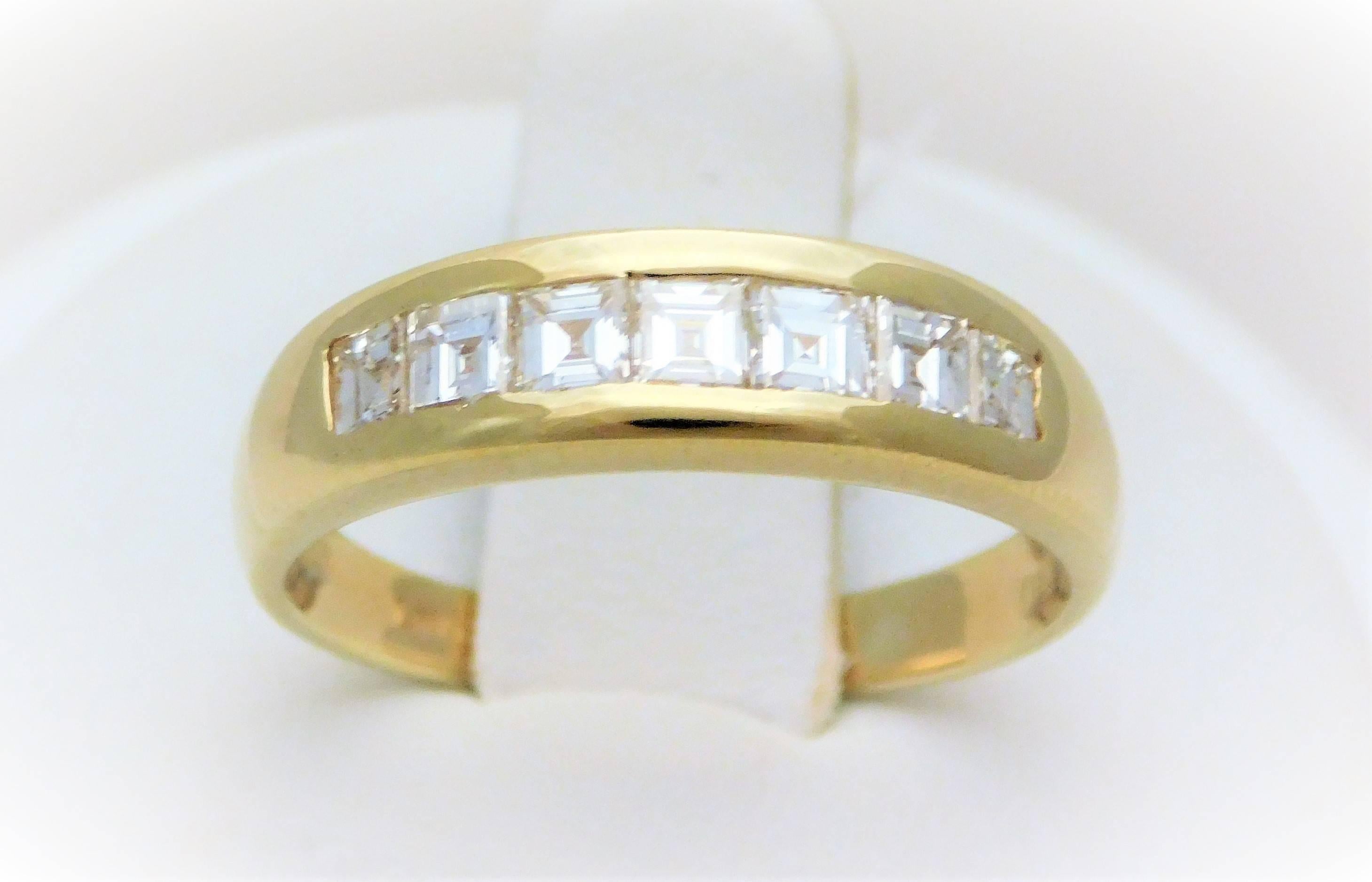 
From a Sothern Gentleman’s estate.  One of the handsomest gent’s bands we’ve ever had.  This modernist-style wedding band has been hand crafted by LANG in solid 18k yellow gold.  It has been masterfully set with 7 incredibly luminous Asscher-cut