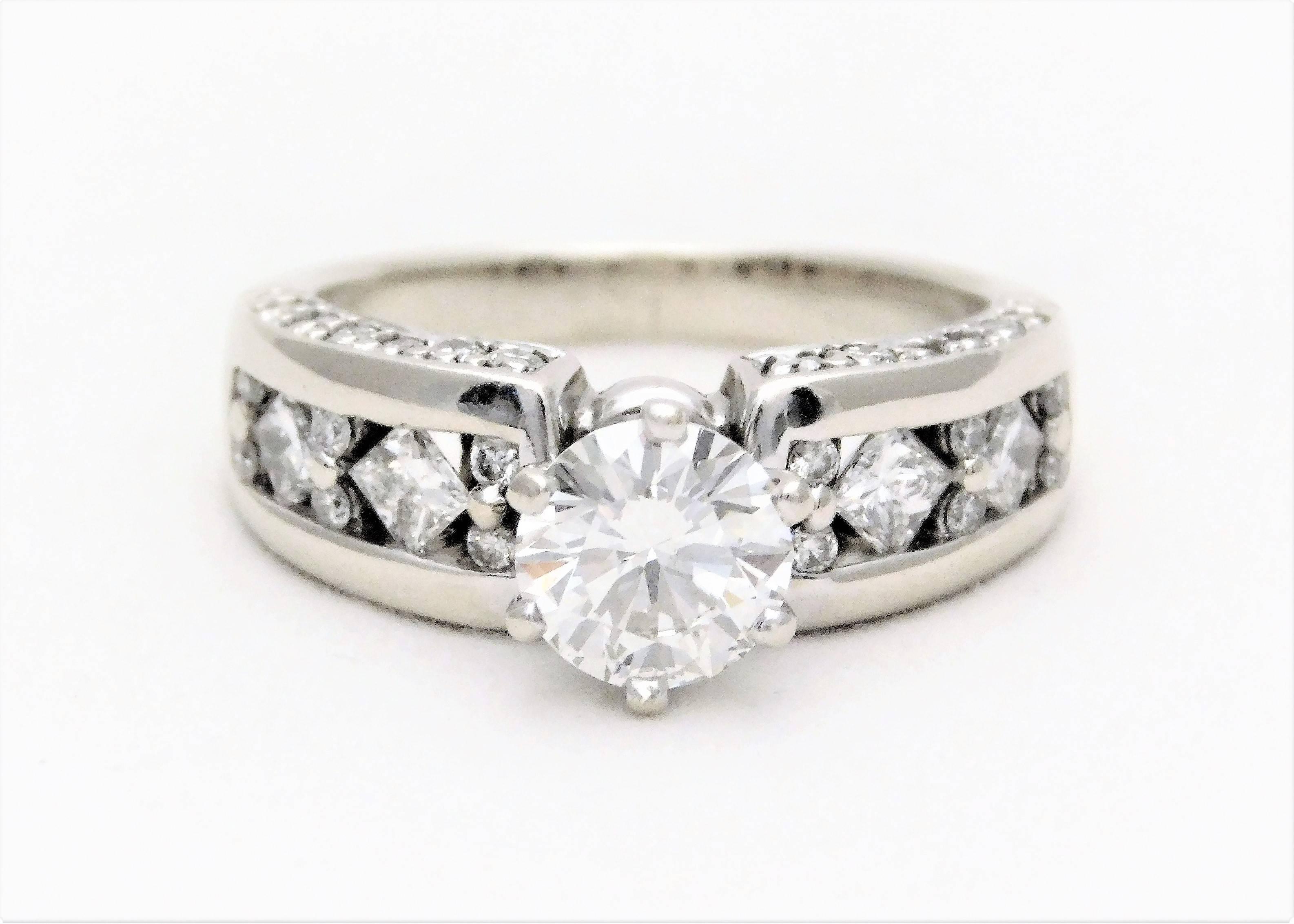 Circa 1990.  From a lovely Southern estate.  This vintage diamond engagement ring has been crafted in 14k white gold.  Completely restored to it’s original “like new” condition.  It has been masterfully jeweled with an extremely luminous, GIA