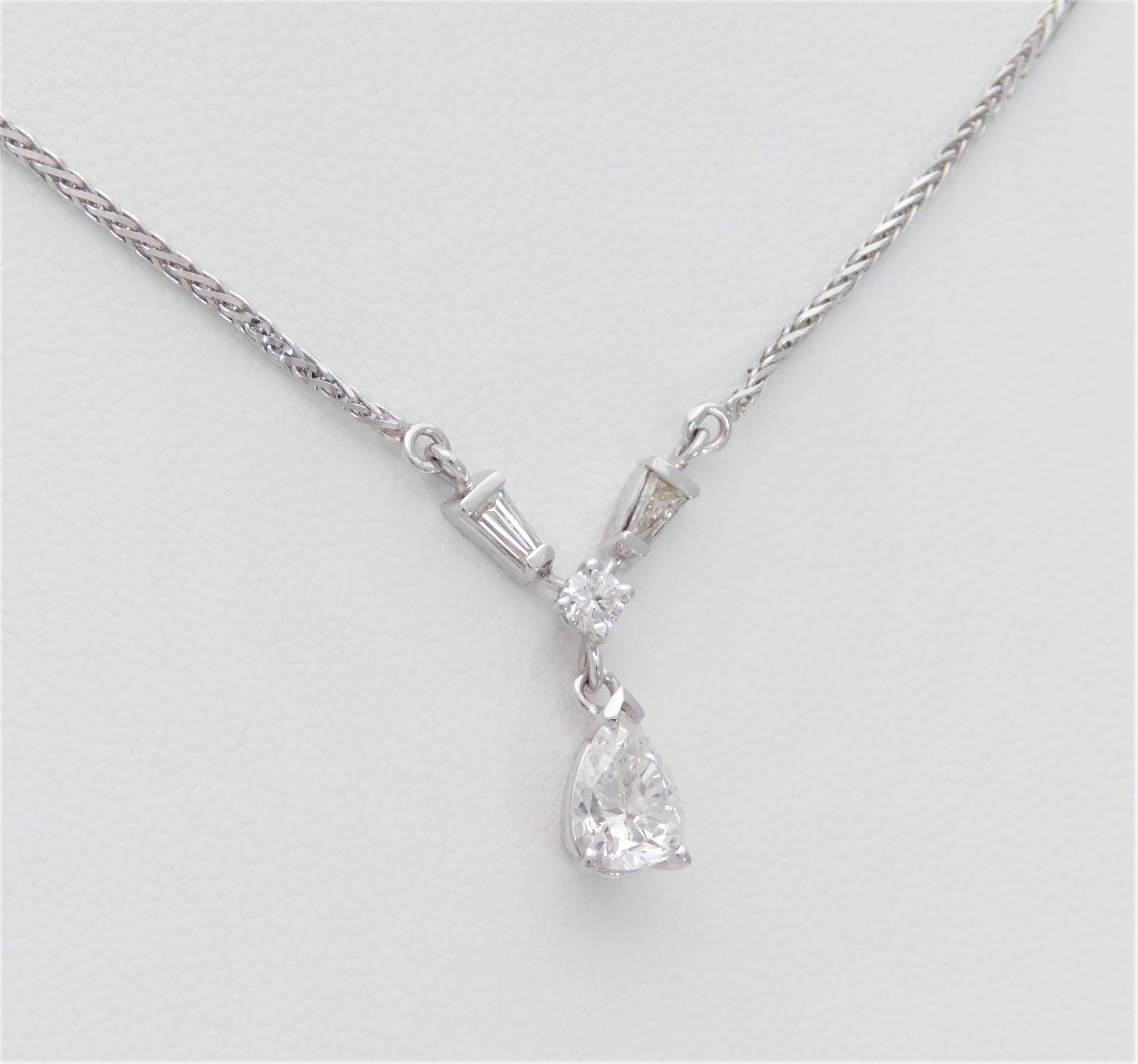 From a charming Southern estate.  Made in Italy, this gorgeous diamond drop-style pendant has been crafted in solid 14k white gold.  In excellent, like new condition.  It features a dazzling natural pear brilliant diamond approximating 1.04ct as its