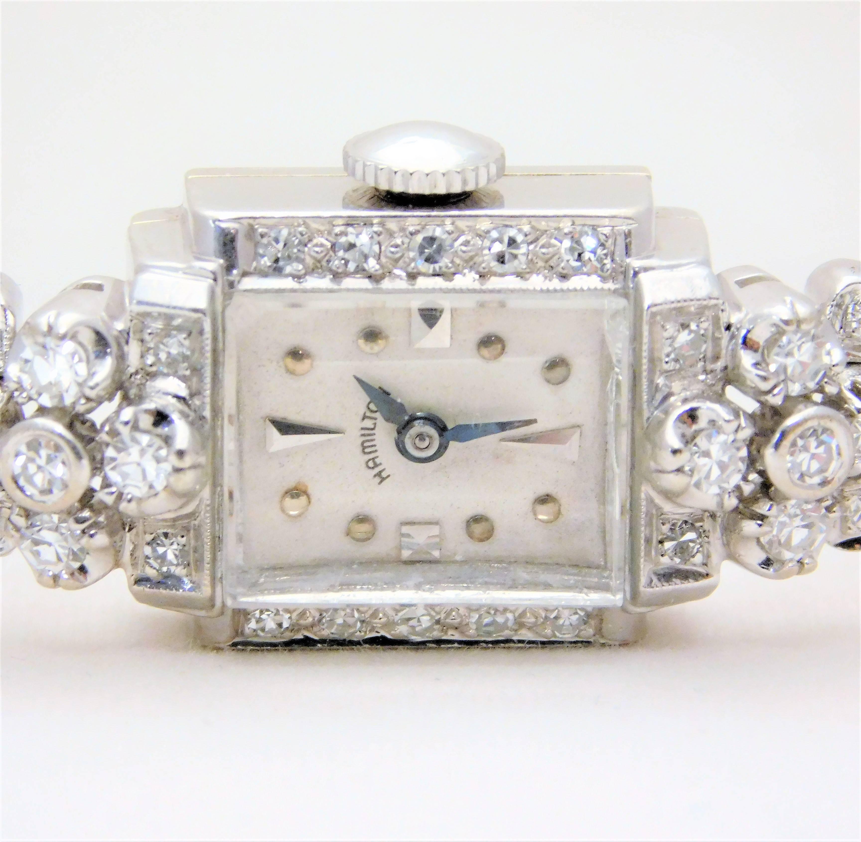 
Circa 1912. This absolutely beautiful Art Deco Ladies Hamilton Diamond wrist watch is made of solid 14k white gold. It has all its original parts along with its 757 model, 22 jewel Hamilton manual movement. It has just been serviced and cleaned and