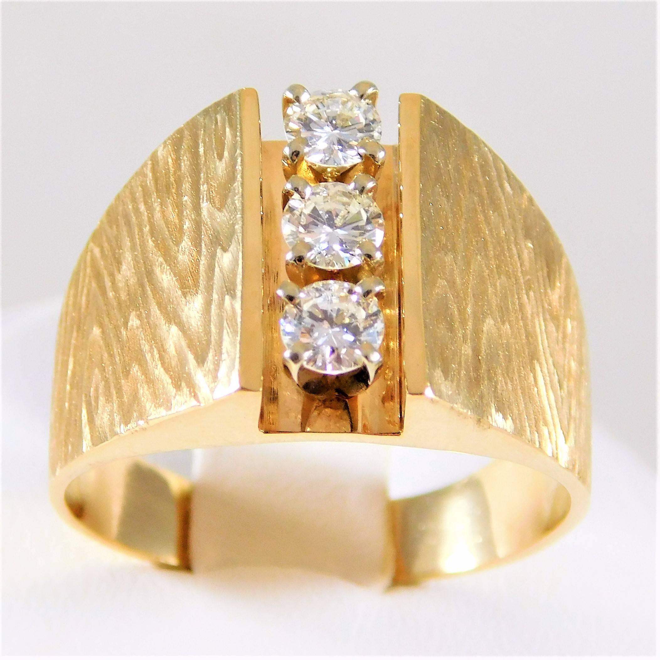 Gents Vintage 14k Gold and Diamond Ring with Damascus Finish
 
Circa 1980-1990.  From a noble New Orleans estate.  This majestic ring has been crafted in solid 14k yellow gold.  The gold finish on this piece is an extremely unique Damascus
