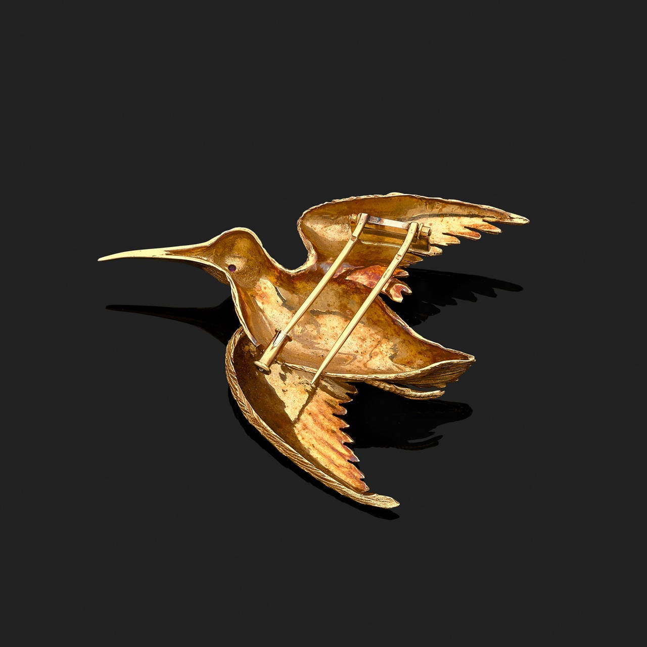 An 18 k yellow gold brooch, stylizing a bird.