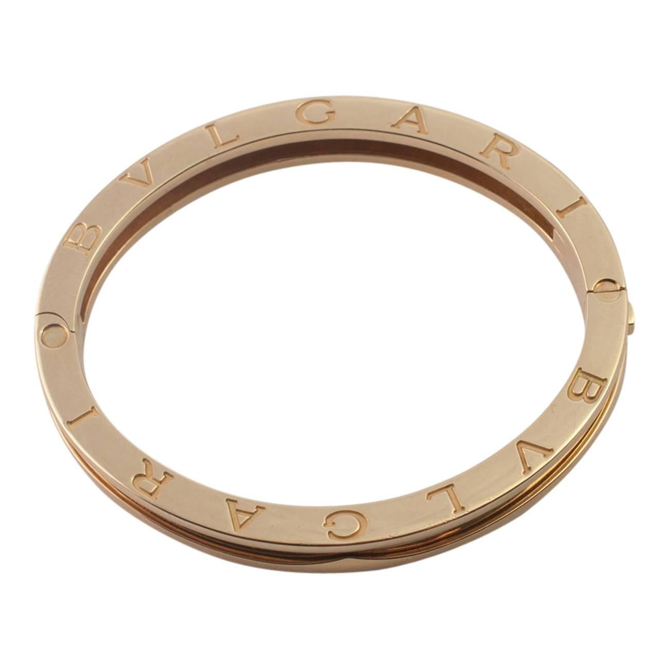 The iconic Bulgari B.Zero1 18ct gold bangle; weight 44.gms, measurements 5.5cm internally and 6.5cm externally, depth 0.75cm.  The bangle has a side opening and closes with a doulble click lock for added security.  It has the worlds BVLGARI 