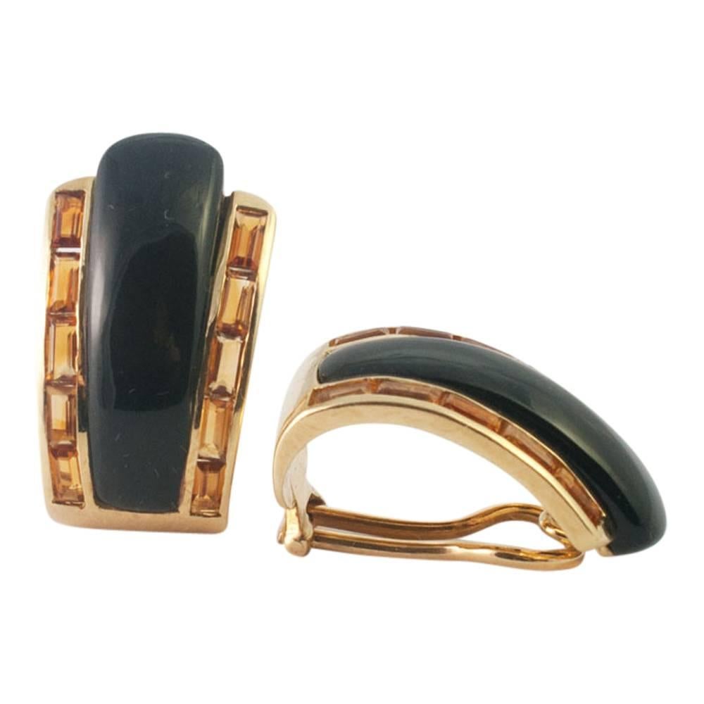Stylish clip-on earrings with tapered onyx and citrine baguettes.  These are for non-pierced ears and are very smart with the two rows of citrines flanking the onyx central stones.  Weight 17gms, Length 2.5cms x Width 1.5cm at the widest point. 