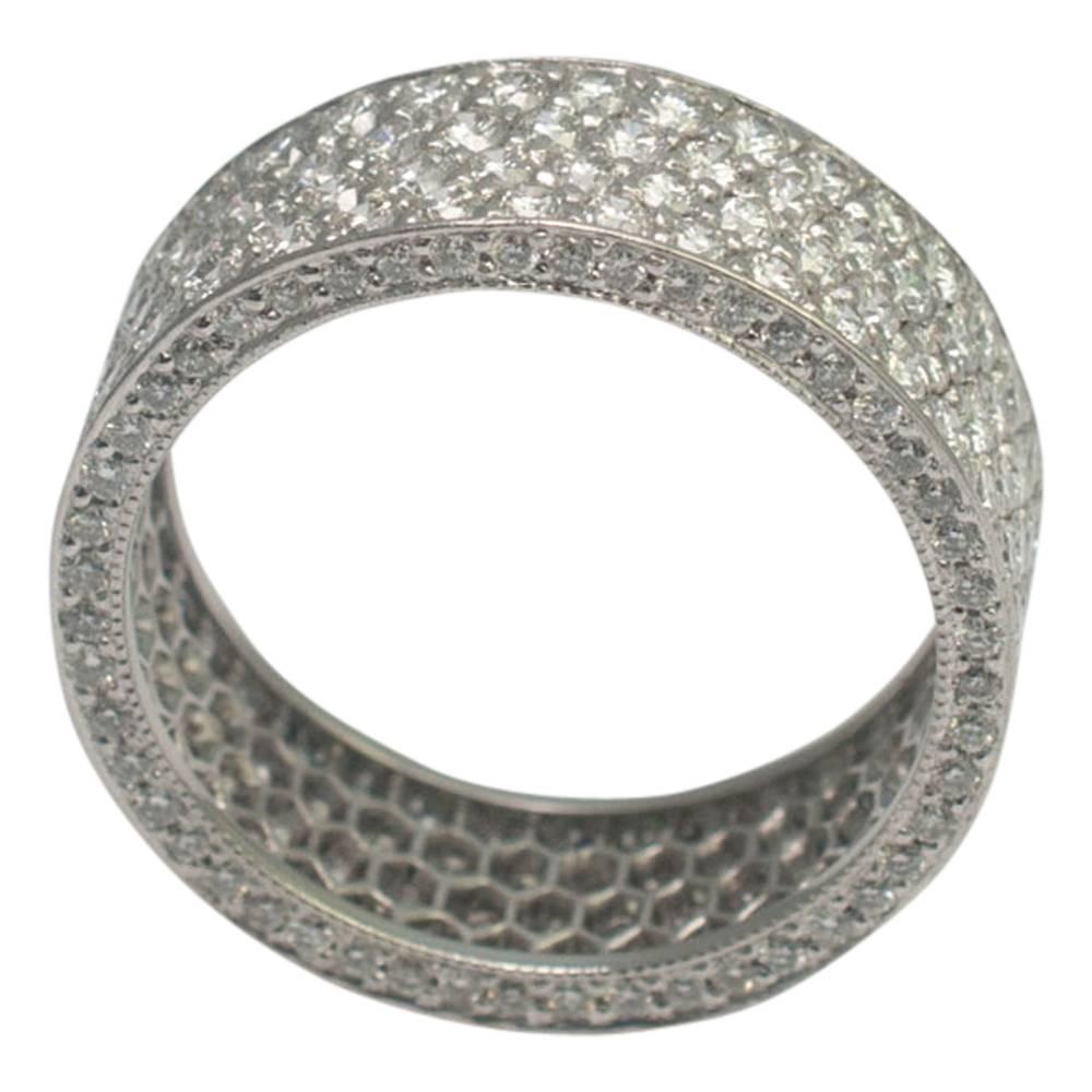 Beautiful platinum and diamond pavé set full eternity ring.  This is a stunning ring set with a honeycomb of bright, white, brilliant cut diamonds totalling 4cts. There are rows of diamonds around the top and bottom of the ring with millegrain