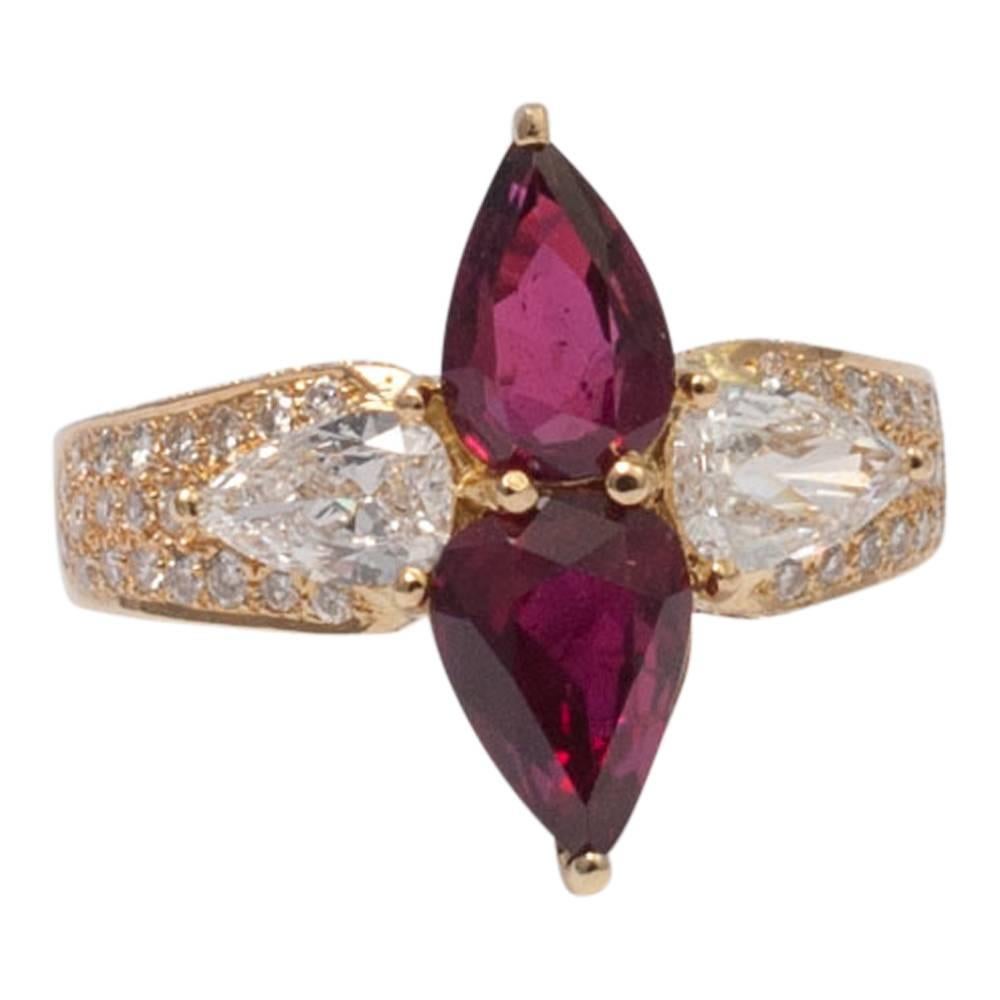 Beautiful double pear shaped ruby and diamond ring by exclusive jewellery house, Adler.  The two, deep blood red pear shaped rubies weigh 2.80ct; on each side of the rubies is a 0.40ct pear shaped brilliant cut diamond of very high colour and