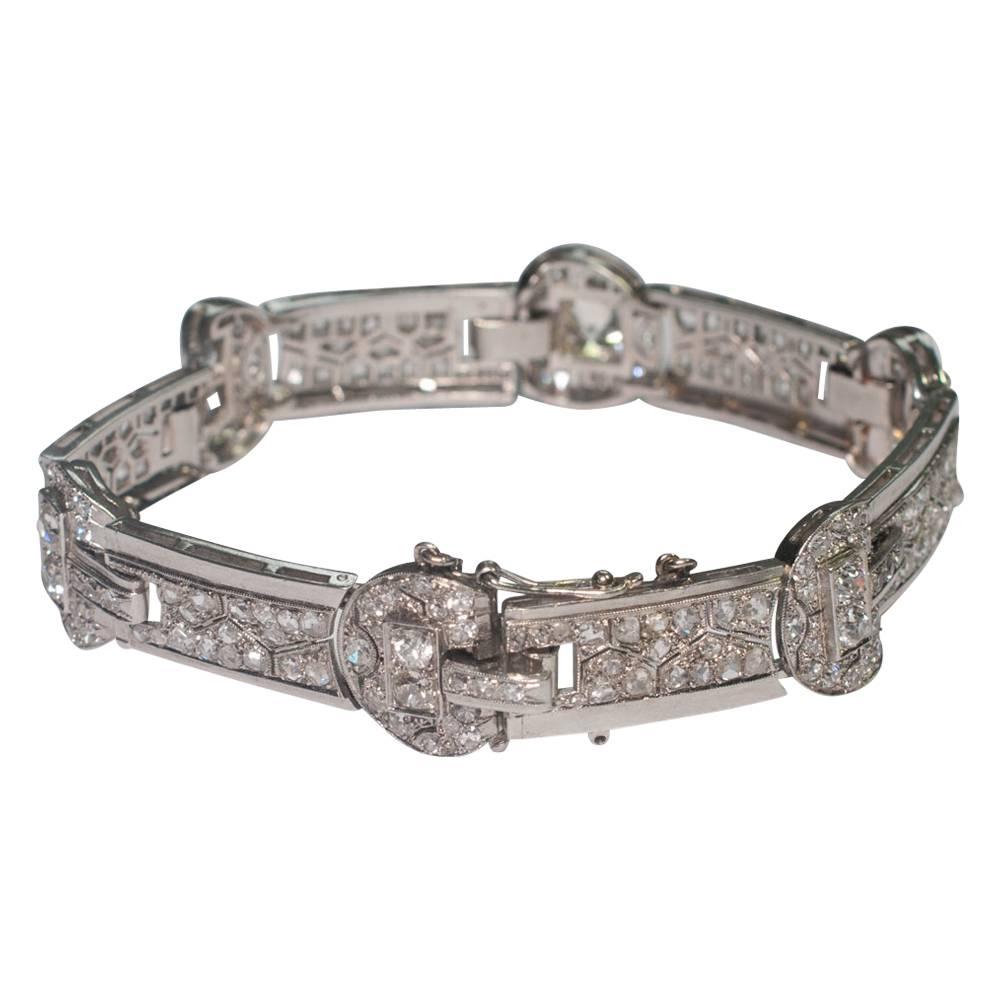 Art Deco bracelet formed of 6 diamond set interlocking sections composed of rose cut and chunky Old European Cut diamonds.  The largest diamond weighs 0.95ct with the total diamond weight 7.30cts.  The clasp is invisibly set into one of the sections