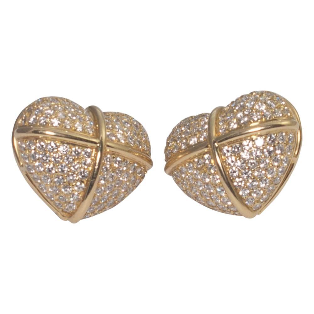 Large diamond set heart shaped earrings by Chopard; these lovely earrings are set with brilliant cut diamonds weighing a total of 5cts.  They are mounted with a post with a large butterfly back fitting for extra security.  Weight 21gms; width 2.5cms