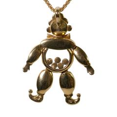 Chopard, collier pendentif clown Happy Diamond en or 18 carats, émeraude, rubis et saphir