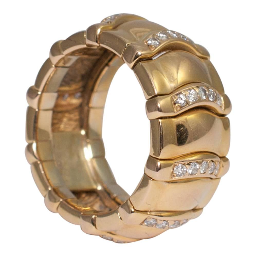 Piaget diamond and gold articulated ring; this intricately crafted ring is in curved alternating diamond and gold sections. The diamond sections move slightly to allow for a comfortable fit on the finger.  Total diamond weight 0.55cts.  The ring is