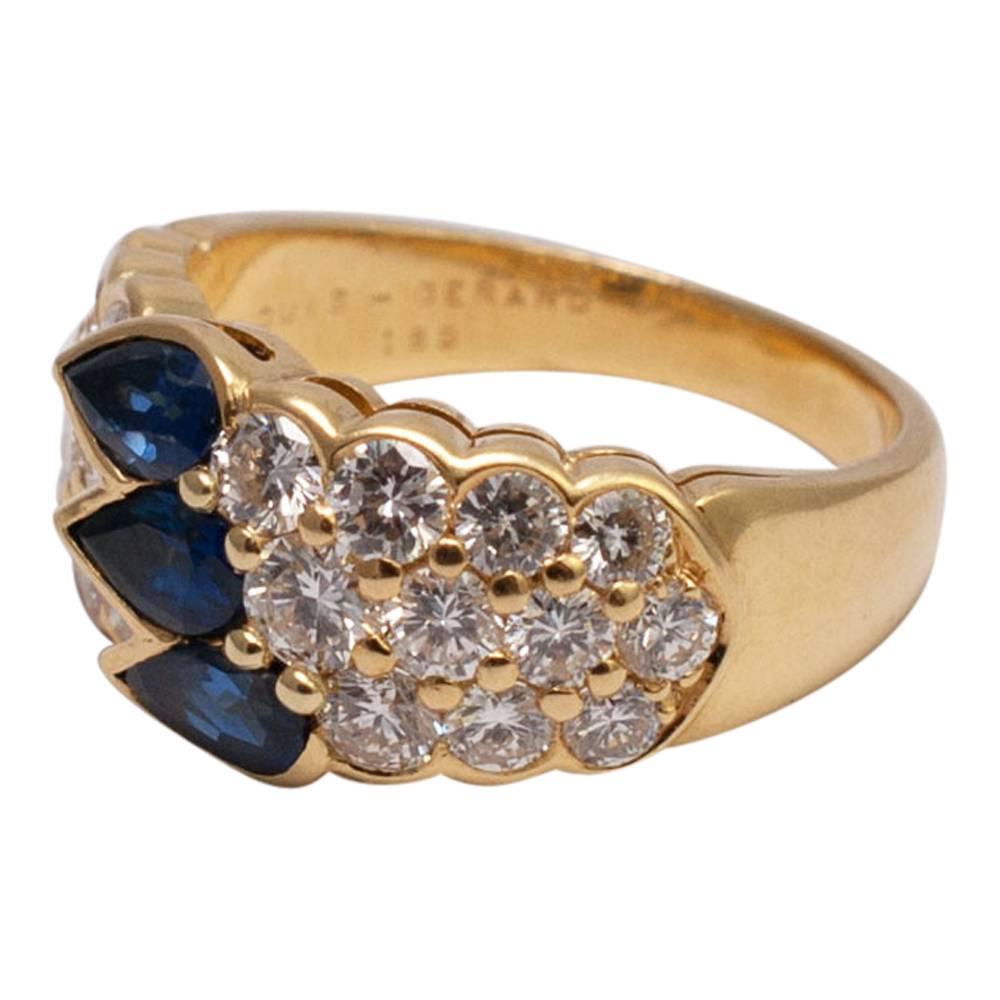 Gorgeous 18ct gold band ring by Louis Gérard set with three royal blue, pear shaped sapphires and three rows of brilliant cut diamonds.  The diamonds weigh 1.89ct. Weight 8.9gms.  Signed LOUIS GERARD, 750 and stamped with the maker's mark and the