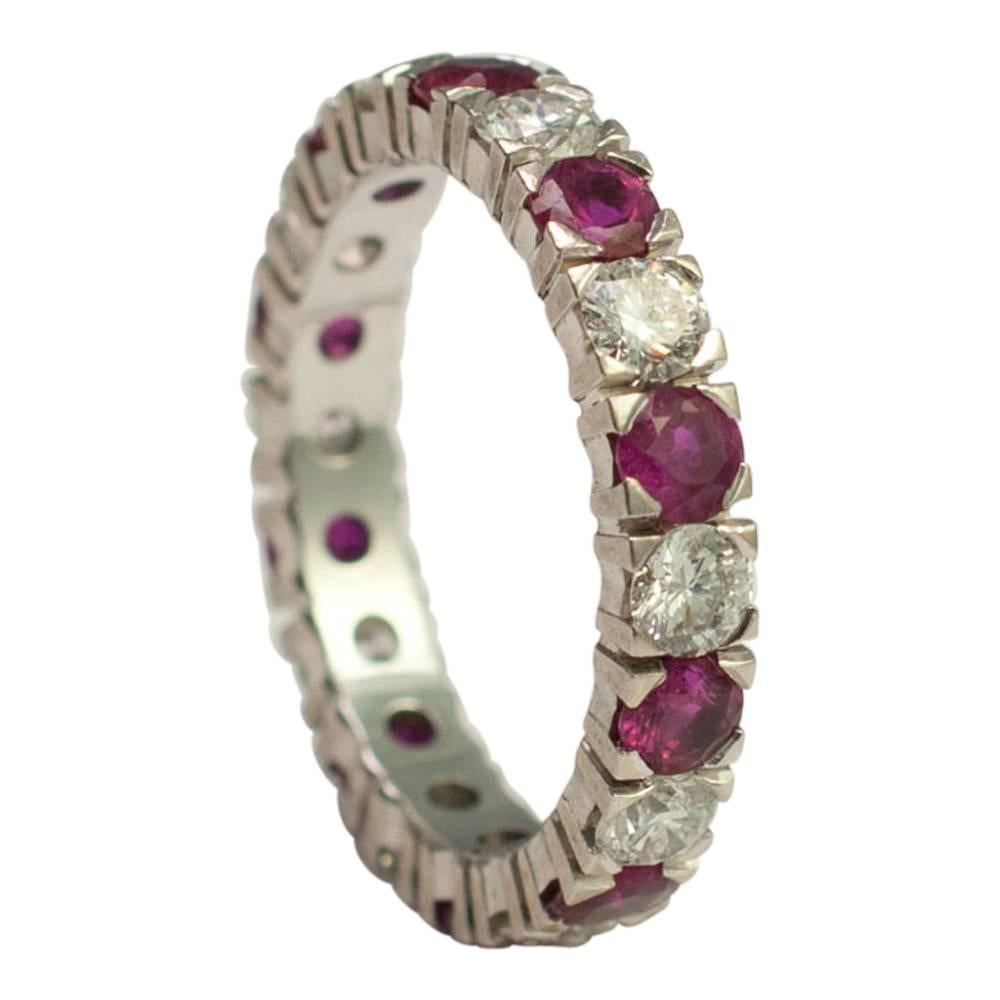 Ruby and diamond full eternity ring; the rubies are a bright crimson red colour and weigh 1.60ct; the brilliant cut diamonds weigh 1.40ct.   Weight 3.6cms.  Stamped 585 (14ct gold).  Finger size M1/2 (UK), 6.75 (US), 53.5 (EU).
There is a video of