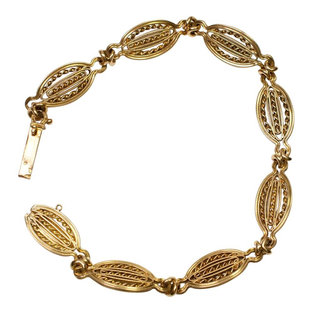 Antique French 18ct gold "Maille ancienne" bracelet formed of 8 oval linked sections and closing with an invisible clasp in the end section.  Stamped with the French state control marks (2 eagles heads) for 18ct gold and maker's mark.   