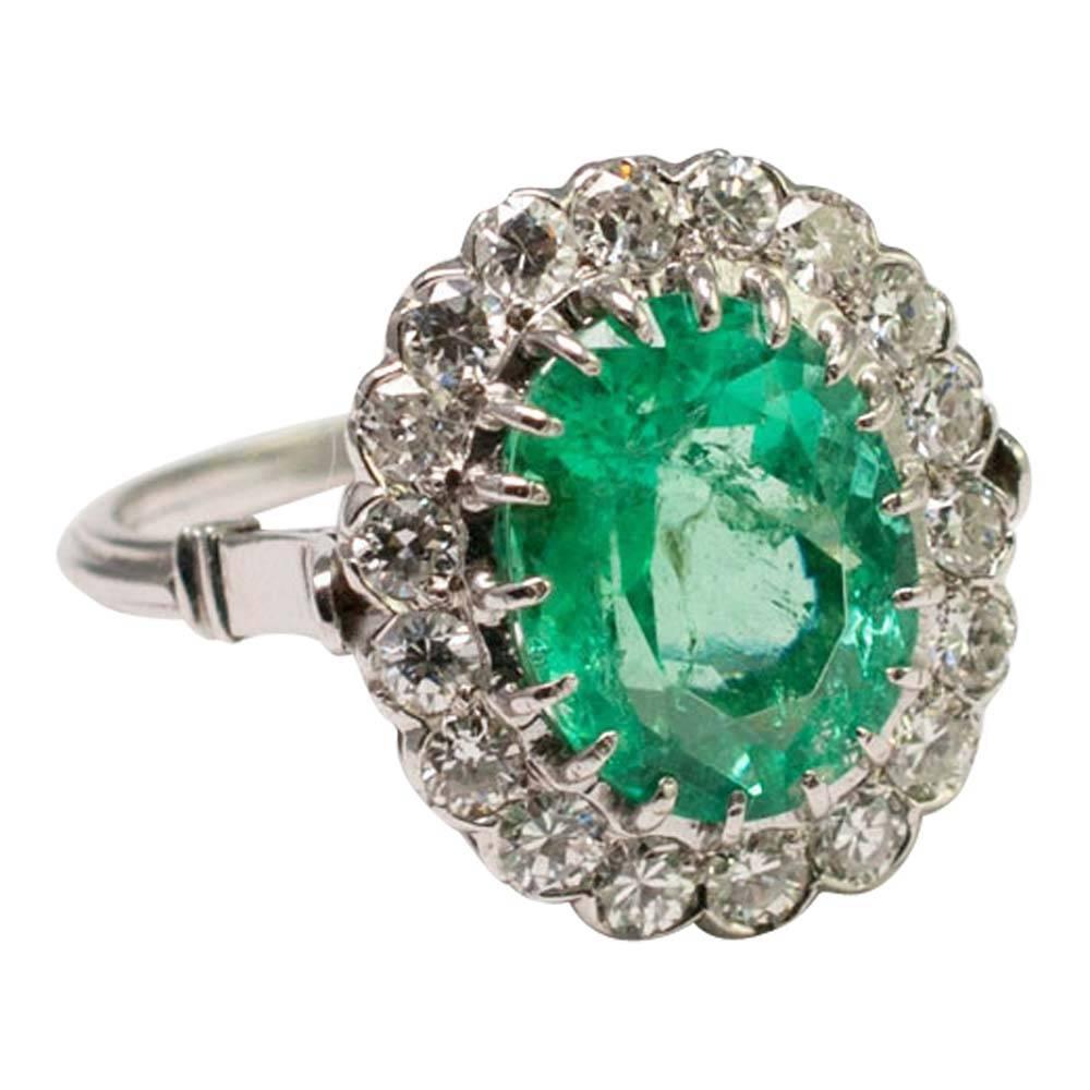 For the lady who loves big emerald rings, this one is a belter! The oval Columbian emerald is a luminous bluish/green colour,  weighs approximately 4.60ct (assessed mounted) and is surrounded by transitional cut diamonds weighing 1.80ct.  The ring 