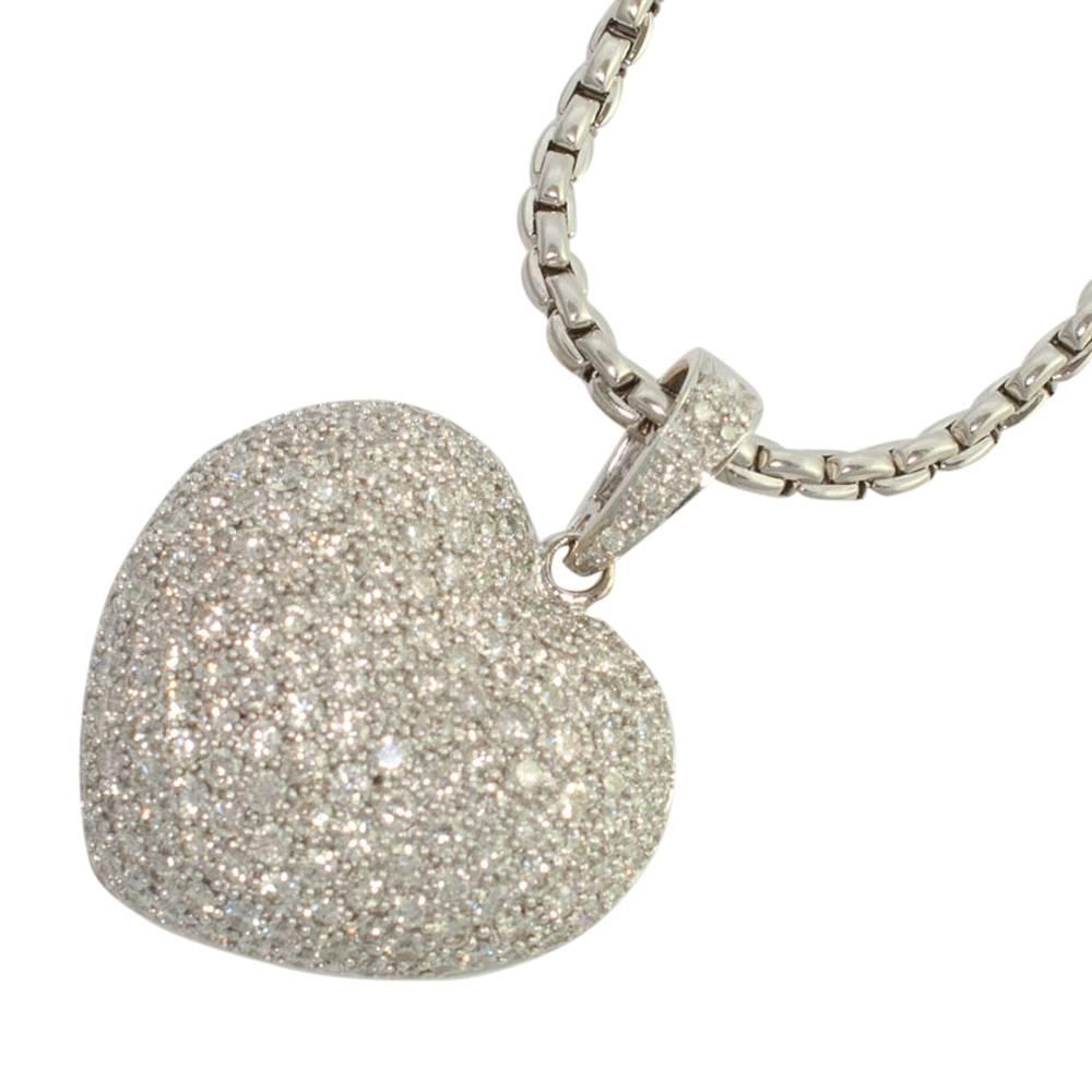 A large and dramatic pavé set diamond pendant on an 18ct white gold chain; the brilliant cut diamonds weigh 6.72cts and are a dazzling white colour, full of fire.  The bale opens and closes on a hinge so the pendant can be worn on a gold chain or a