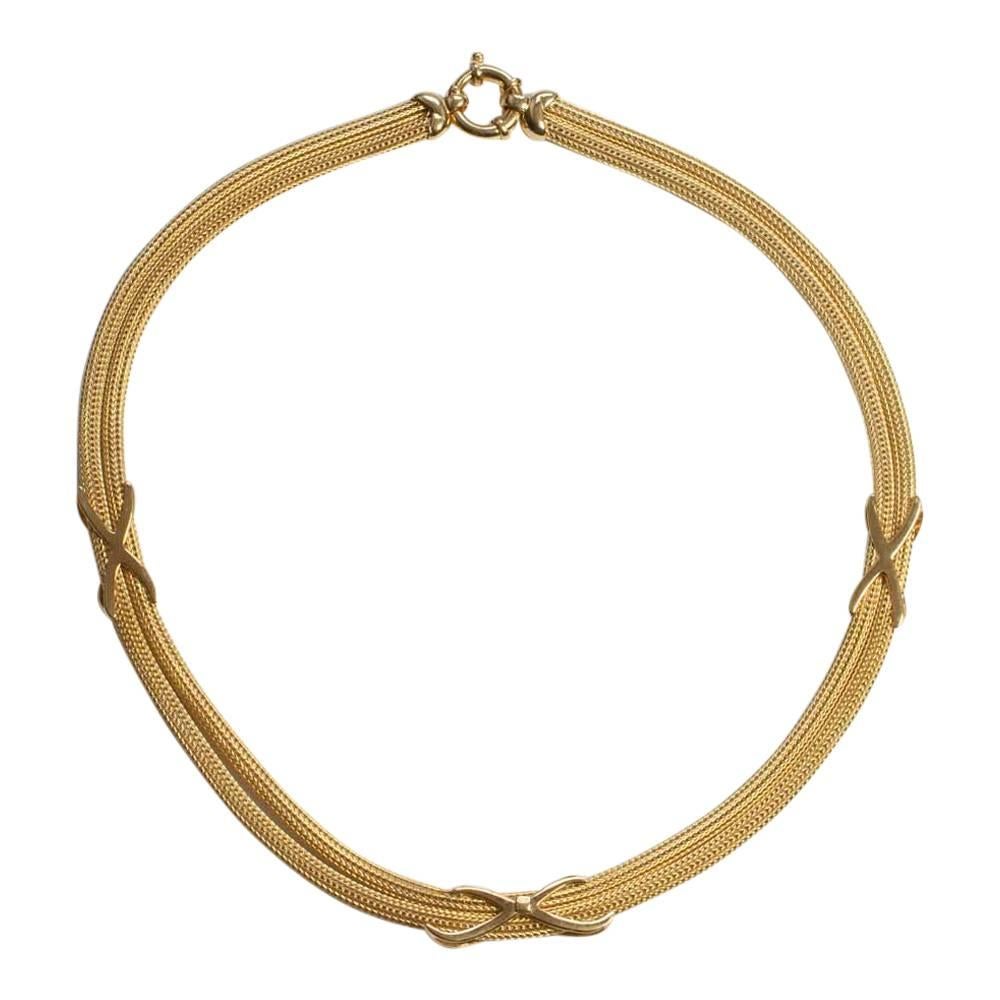 Beautiful, stylish vintage 18ct gold necklace; this is crafted in a flexible woven design formed of two sections, linked by crosses.    This necklace is very confortable to wear due to its flexibility and fastens with a large bolt ring clasp. 