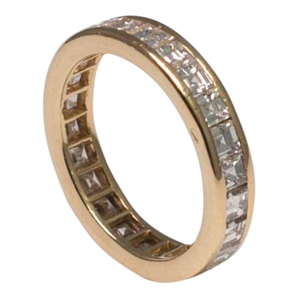 Women's O.J. Perrin Square Diamond 18 Carat Yellow Gold Eternity Ring Circa 1970 For Sale