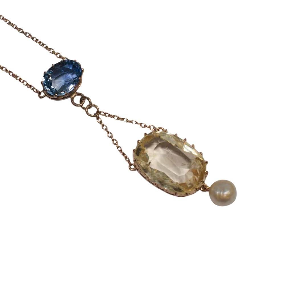Edwardian natural yellow and blue Sri Lankan sapphire pendant with natural saltwater pearl; this lovely antique pendant has a yellow sapphire certificated as No Heat and weighing 13.83cts, originating from Sri Lanka; the blue sapphire is also