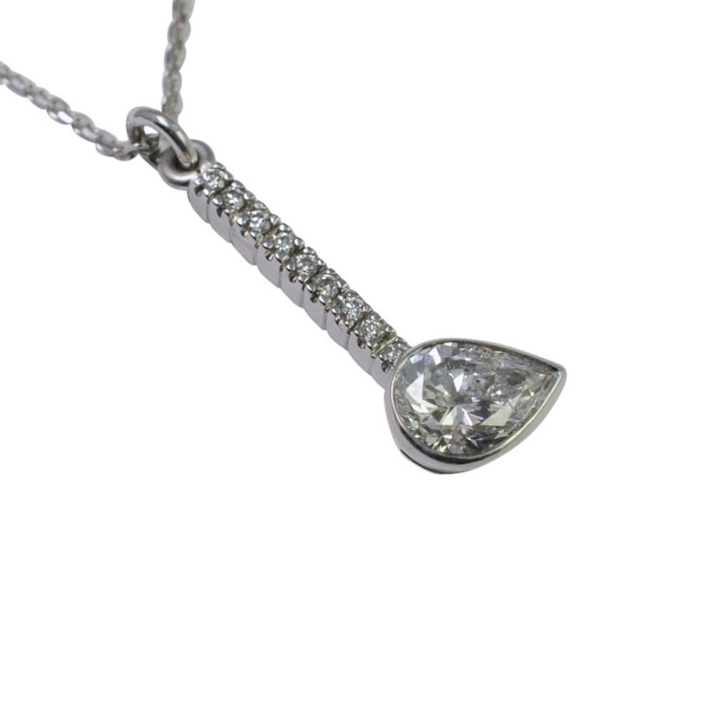 Contemporary pear shaped diamond pendant; the diamond weighs 0.90ct and is offset at the end of a line of brilliant cut diamonds.  This gives it a contemporary feel for the person who prefers something unusual instead of the traditional setting.