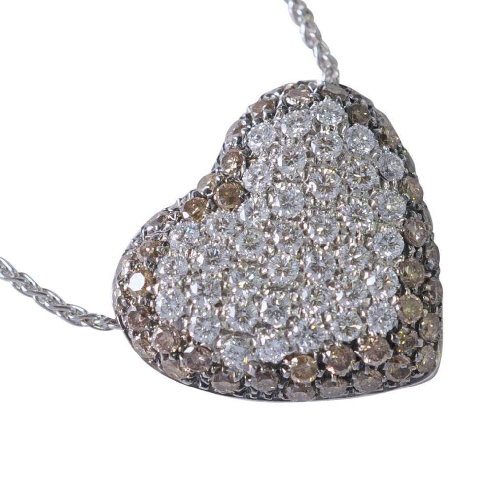 Diamond heart pendant set with two tones of diamonds; around the edge are warm, champagne diamonds weighing 0.74cts and in the centre there are 0.81ct of sparkling white brilliant cut diamonds.  The heart measures 1.9cm depth x 1.6cm width and
