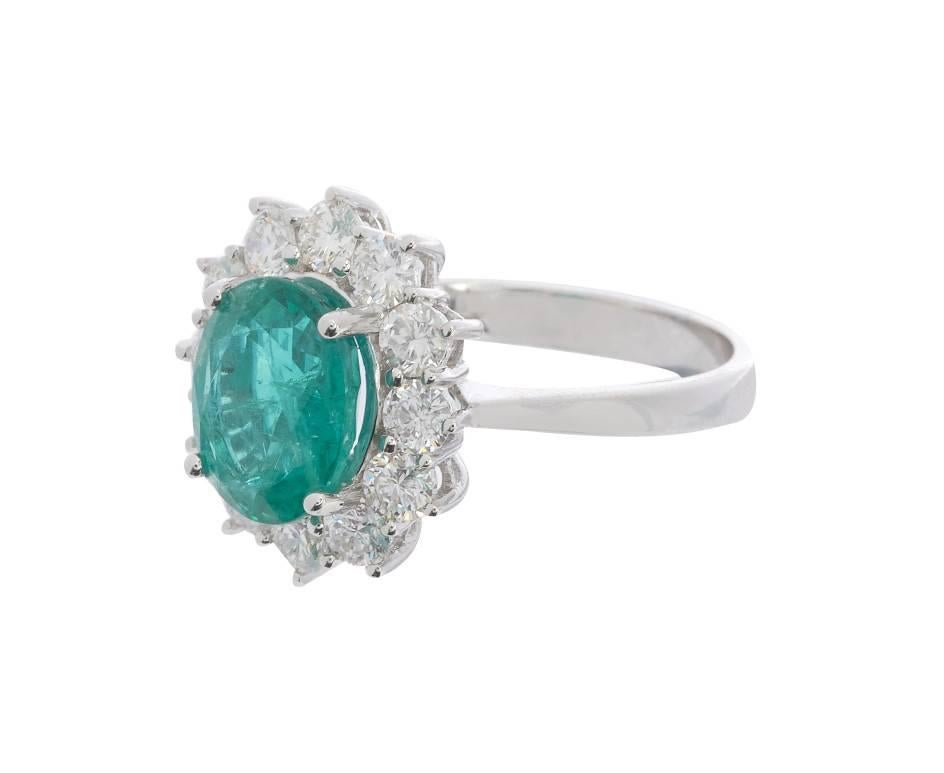 Modern 18 Carat White Gold 2.68 Carat Emerald and 1.29 Carat Diamond Cluster Ring For Sale