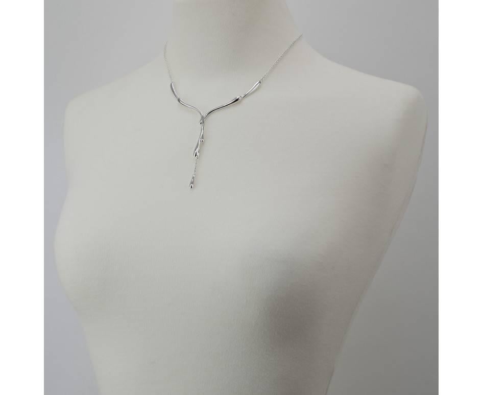 Lucy Quartermaine

Drip Collection

Inspired by the beauty of water. Elegant Drips of water that are created by nature and formed to give a molten Silver effect.

Flowing necklace from the Drip Collection.  Y-shaped necklace emulates pouring silver.