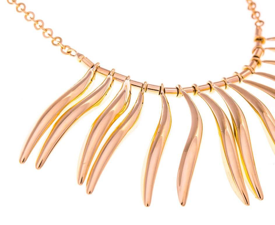 Waves of gold emanate from this stylish necklace. A stunning addition to your favourite little black dress or to jazz up a fine shirt.