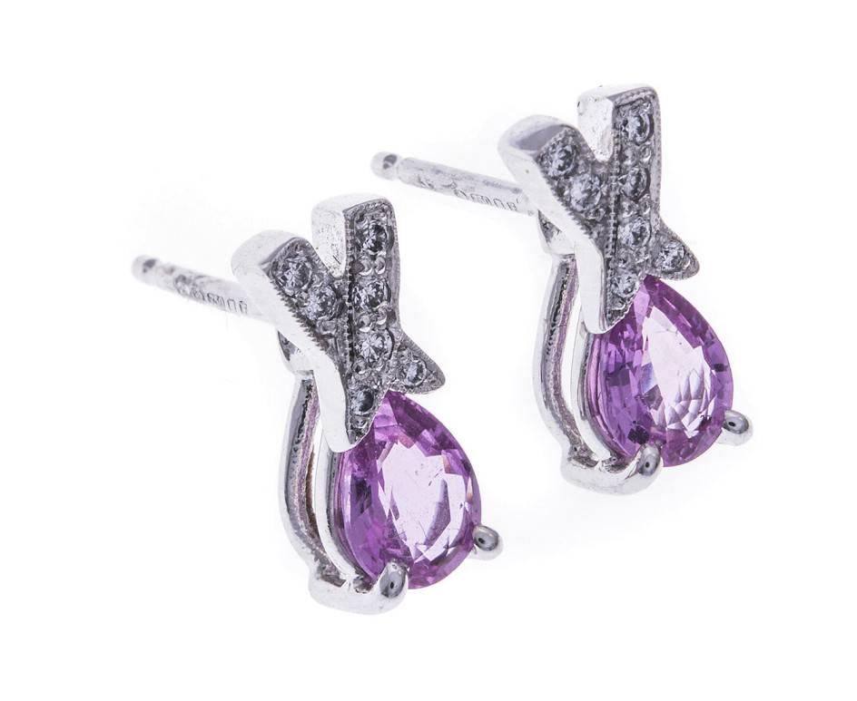 These gorgeous earrings are British made and exhibit the wonderful gemstone Spodumene. These delicious pink gems are faceted into a beautiful pear shape and set beneath stylish swathes of 18ct white gold and diamond creating a glowing and elegant