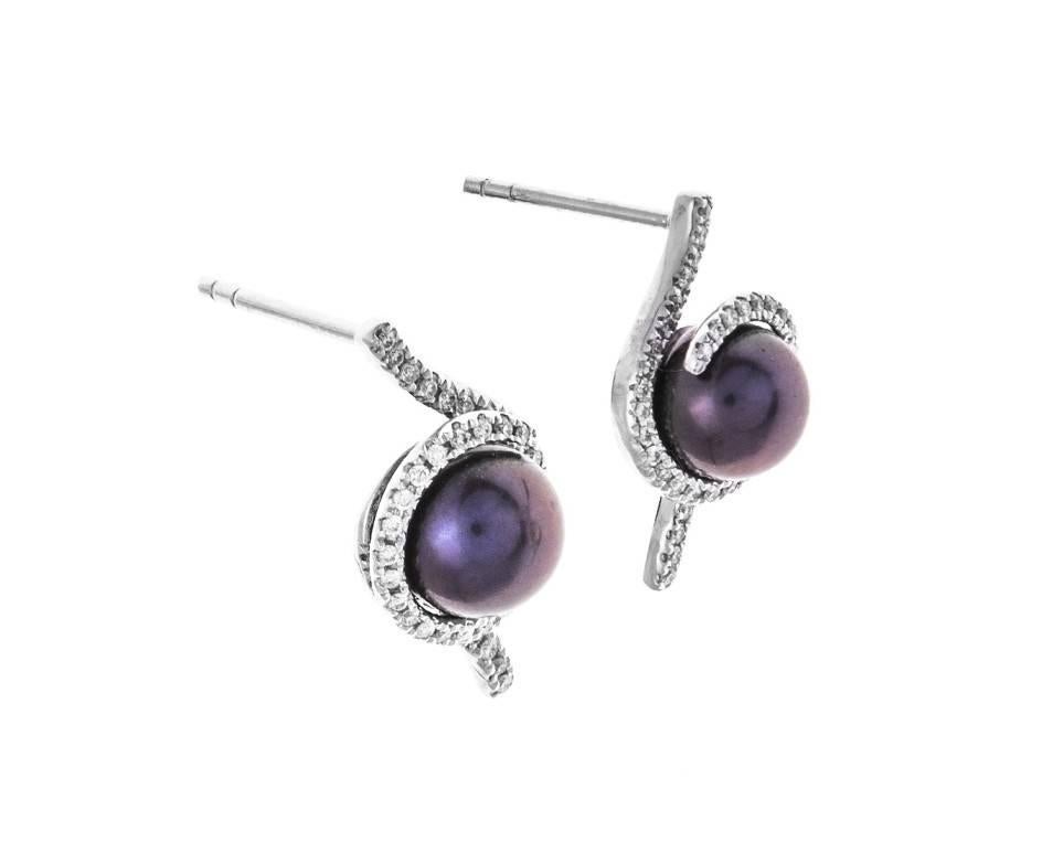 Rich aubergine coloured 7.10mm cultured pearls wrapped in a spiral of diamond encrusted white gold creating these fabulous Deco style earrings. A gorgeous gift for a pearl anniversary or a special treat for a June birthday.