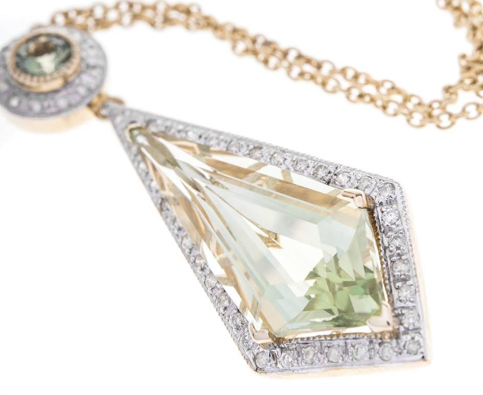 An exquisite and sprightly necklace fashioned in yellow gold (tested as 9ct). This fabulous piece boast approximately 6.00ct of green amethyst (also called prasiolite) framed with white gold and diamonds (0.20ct total approx) and complete with gold