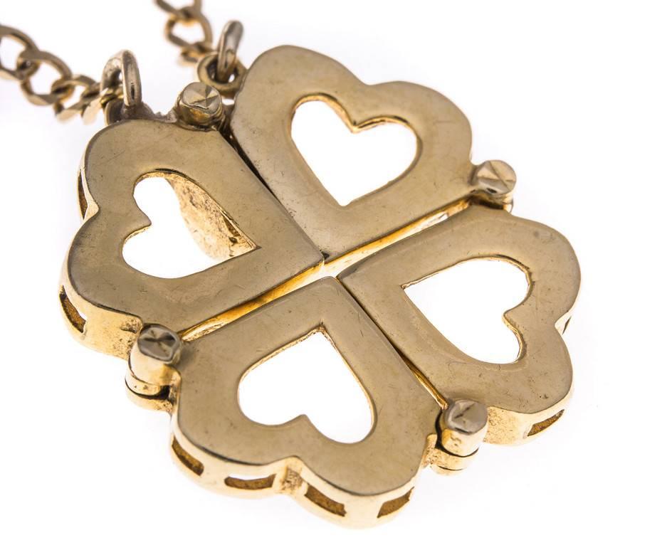 A wonderful necklace crafted from 14ct yellow gold (as tested). It can be worn in two styles. Firsly it can be worn as a quatrefoil open work heart pendant and secondly it can be worn as a line of golden hearts when the top magnets are separated. A
