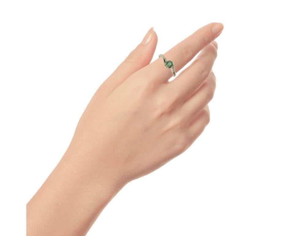 A beautiful deep green emerald embraced in a swathe of warm gold and highlighted with sparkling diamonds.A great gift for a May birthday, a love token or just because.

SPECIFICATION
Weight (grams)	1.92
Fineness	9ct
Metal	Yellow