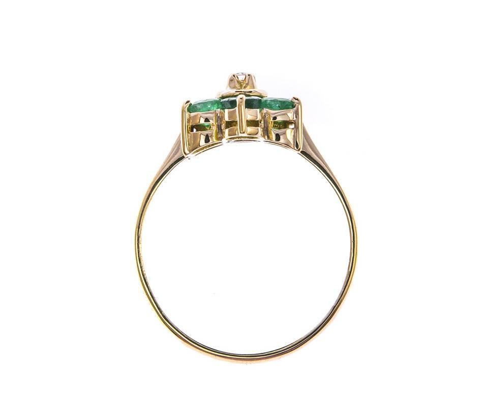 A delicious 18ct gold ring (as tested) set with vivid green emeralds in a floral arrangement surrounding a sparkling diamond. A beautiful gift for a May birthday or an emerald occasion.


SPECIFICATION
Weight (grams)	2.55
Fineness	18ct
Metal	Yellow