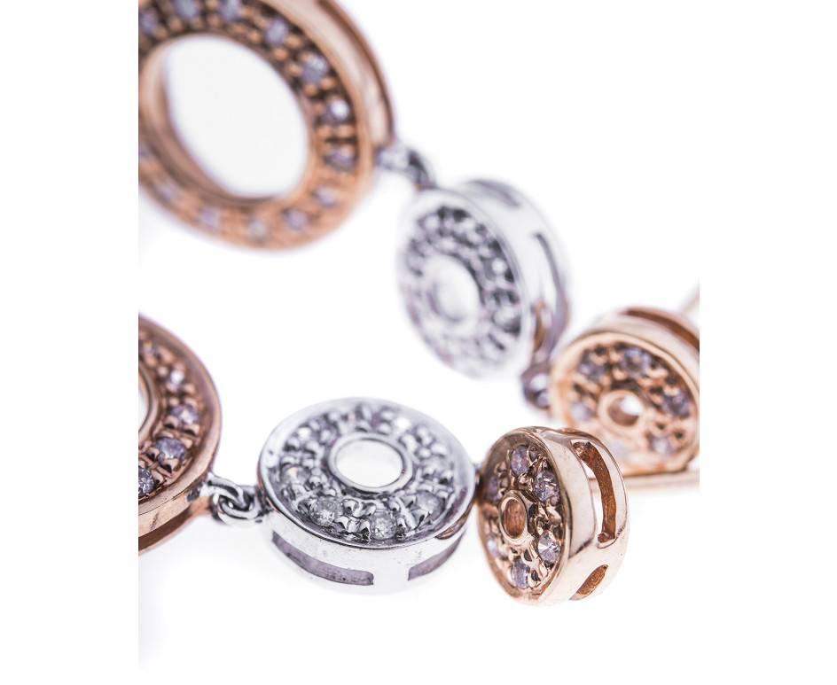 With three graduating circles of rose and white gold, these delightful diamond set pieces are the perfect dressing up adornment for any special occasion.

SPECIFICATION
Weight (grams)	3.00
Fineness	14ct
Metal	Rose Gold
Hallmark	Stamped 14k, Tested