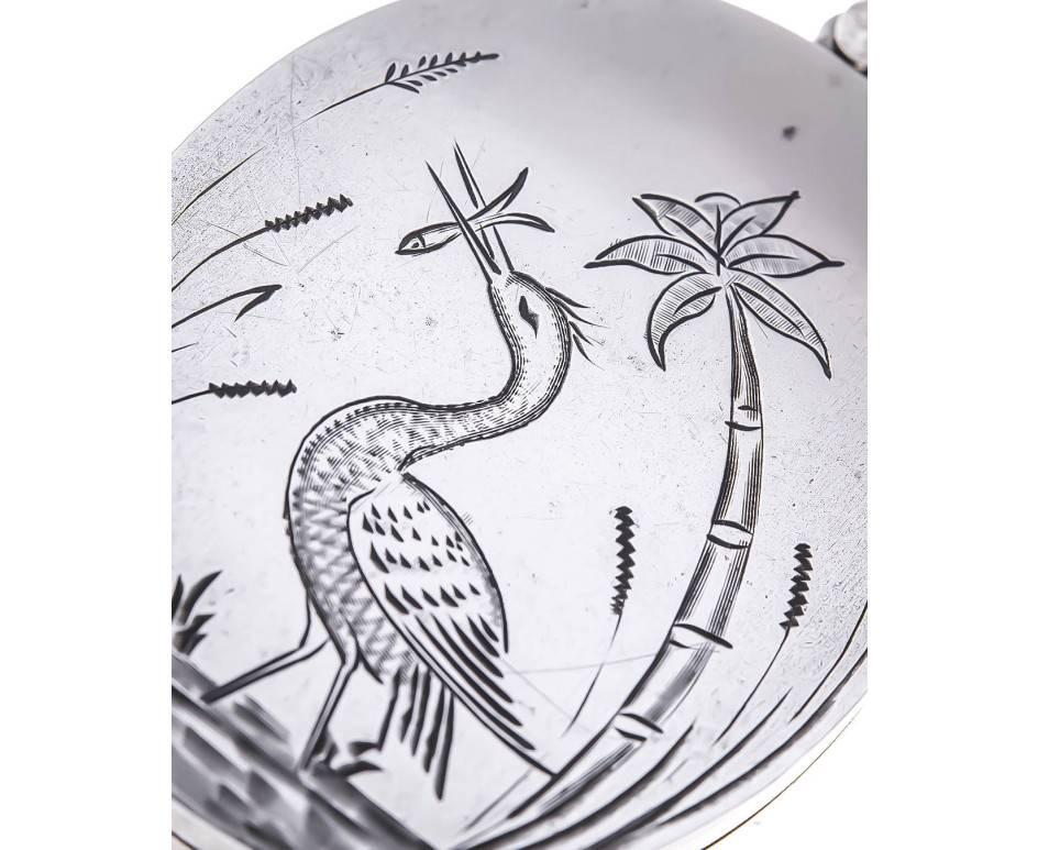 A beautifully designed locket, One side with depicting a heron, surrounded by reeds and leaves, this symbolises calmness patience and determination. The other side depicts a floral design, gathered by a vacant cartouche. The perfect space for a