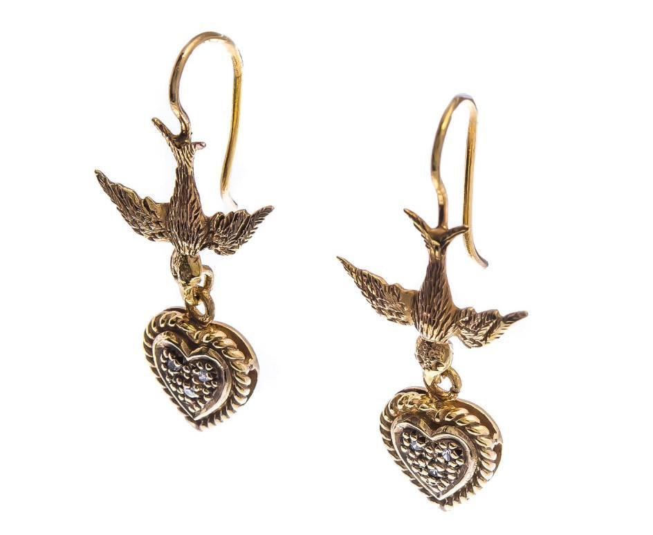 GEMMOLOGIST'S NOTES
The sparkling diamond heart, suspended from a the textured swallow.

A pretty pair of earrings, that are wonderful for any occasion. These would be a lovely gift for a 18th birthday.

SPECIFICATION
Weight (grams)	2.30
Additional