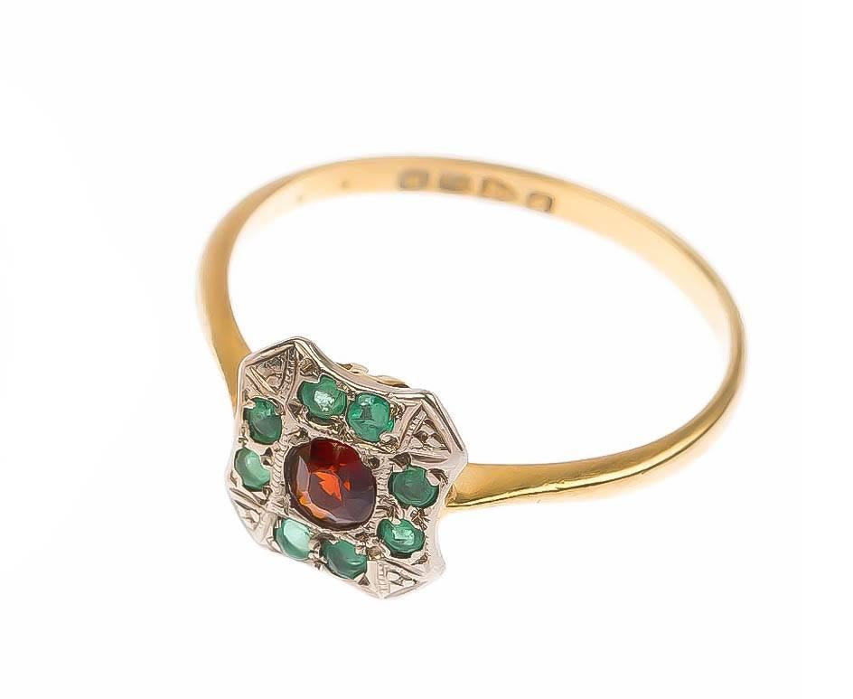 This beautiful Art Deco ring, the scalloped cluster, with central delicious garnet, surrounded by gorgeous vivid emeralds!

A truly gorgeous piece from the roaring 20's! The perfect gift for the festive season.

 
SPECIFICATION
Weight