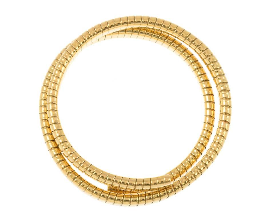 GEMMOLOGIST'S NOTES
Following some of the most poignant designs made famous from top Jewellery Houses, this shimmering and sleek coiled gold bangle makes an impressive piece to wear for all occasions. Slightly expandable and easy to wear it's a