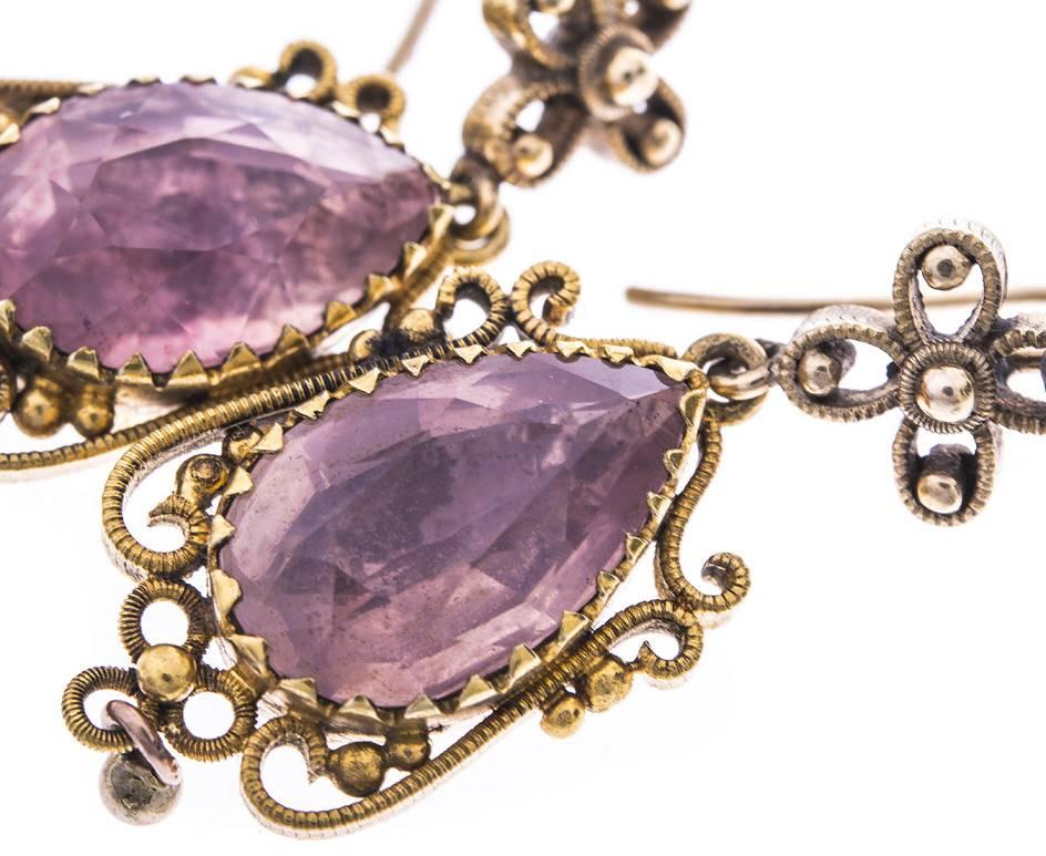 GEMMOLOGIST'S NOTES
These delightful earrings, the pink foil back quartz, encased within a delicate surround, suspended from a  floral surmount. 

A lovely pair of earrings, that can be worn for any occasion. 

SPECIFICATION
Weight