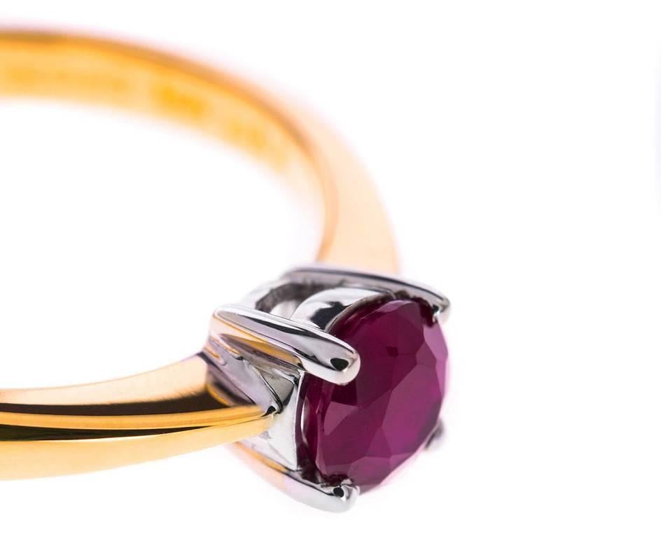 Ruby is the gemstone of love. This rich red round faceted beauty is set in warm yellow 18ct gold creating a delicious and striking solitaire ring. An unusual but heart felt take on the classic engagement ring, a July birthday present or an