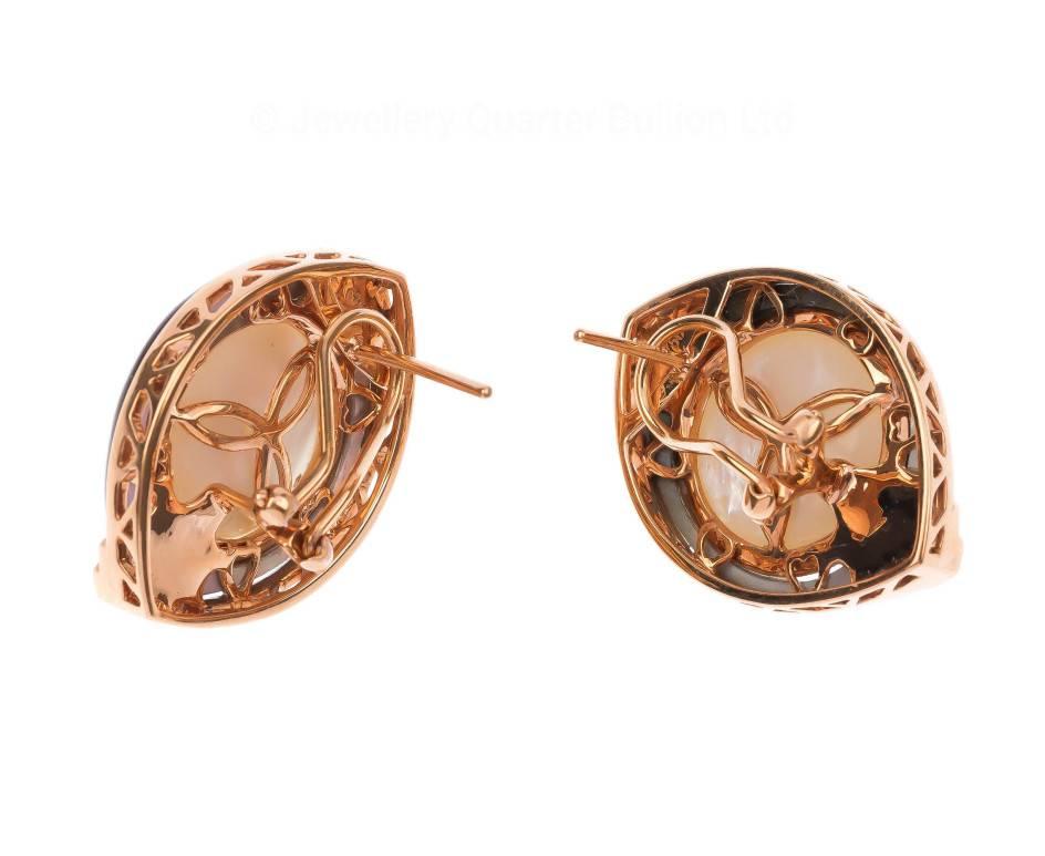 GEMMOLOGIST'S NOTES
 These stunning earrings are set with a 13.5mm Mabe pearl and enclosed by highly polished black lip Mother of Pearl and approximately 0.25ct of fiery diamonds. Crafted in rose gold, these amazing creations are a one off design