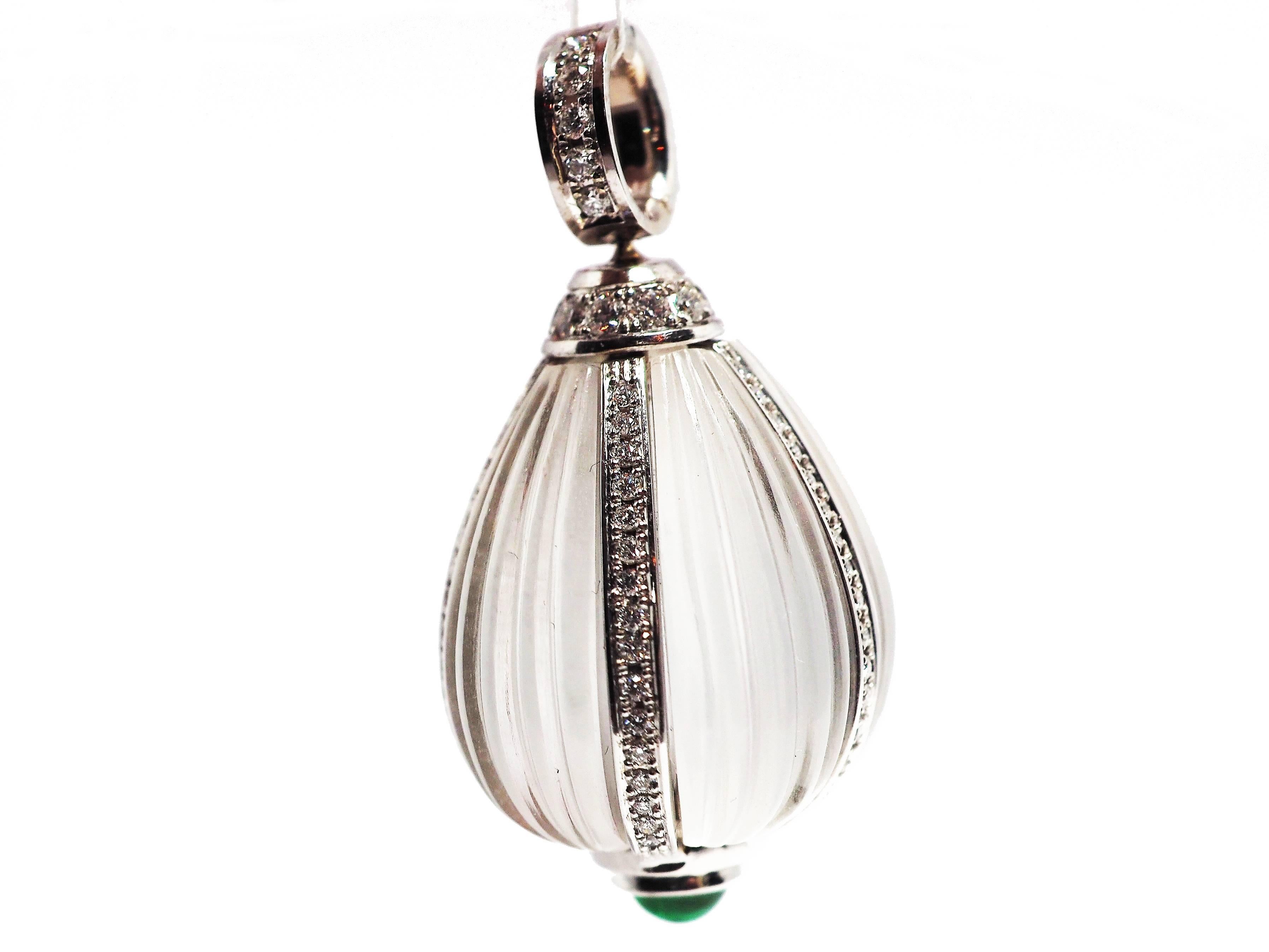 New from the Leyser London collection – Le Touch

An exquisite pendant with a mysterious heart.  The craftsman encased a perfect, carved rock crystal within bands of 18k white gold, and placed a athomless green emerald cabochon drop at its base. The