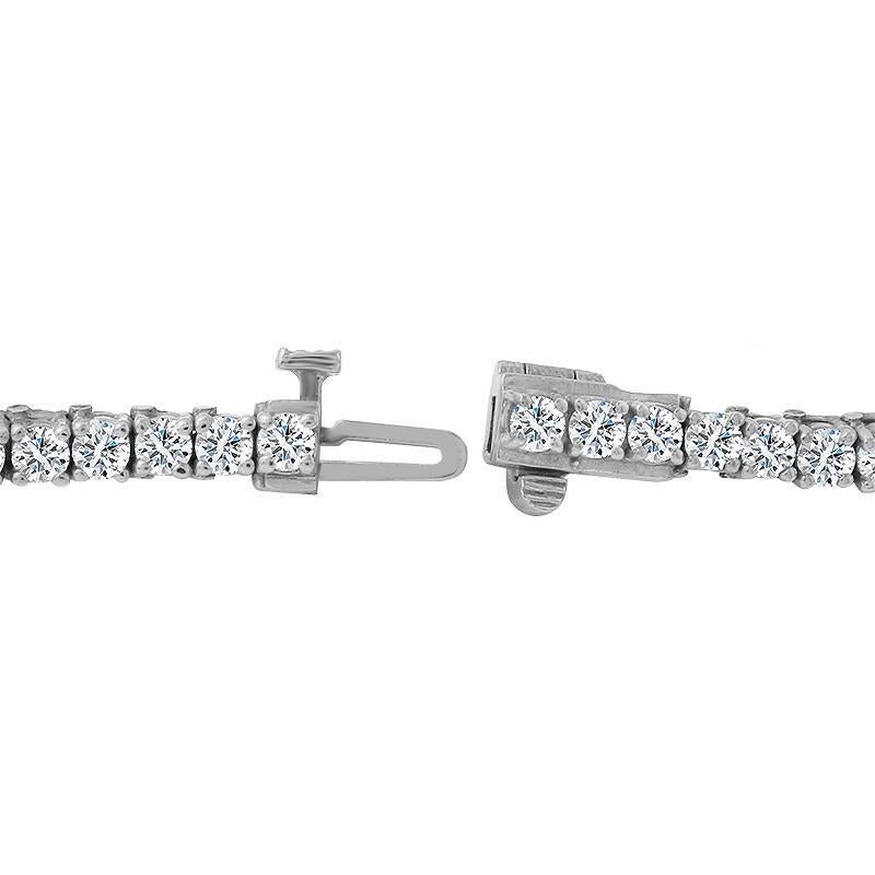 Stunning and timeless this 18 karat white gold tennis bracelet set with 39 brilliant round cut diamonds equaling 12.50 carats.  The bracelet weighs approximately 14.80 grams. 7 inches.