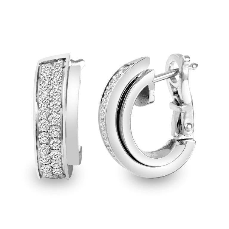 Gorgeous Piaget Possession 18k white gold diamond hoop earrings set with 54 brilliant round diamonds equaling 0.60 cttw., VS-SI1 in clarity, G-H color, measurements:  5/8 mm x 1/4 mm.